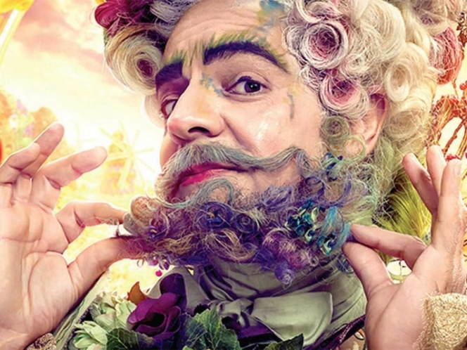 Eugenio Der­bez le echa flores a los niños